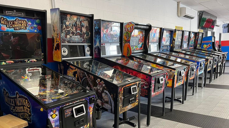 retro pinball machines lined up in a row