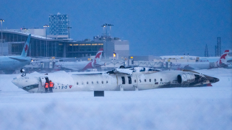 Delta CRJ-900 upside down on runway