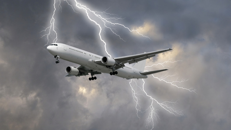 Passenger plane being struck by lightning.