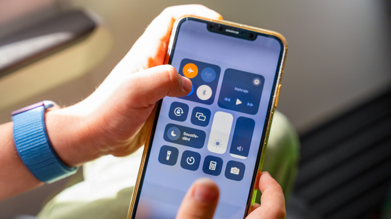Person with phone in airplane mode
