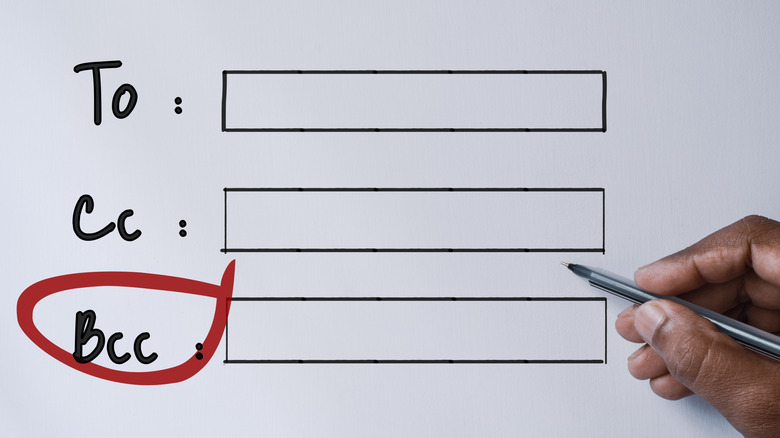 A hand circles the BCC field of an email header