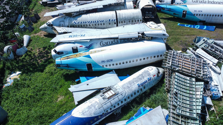 An airplane graveyard with parts ready to recycle