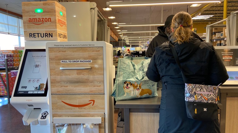 woman returning Amazon goods at the Whole Foods store