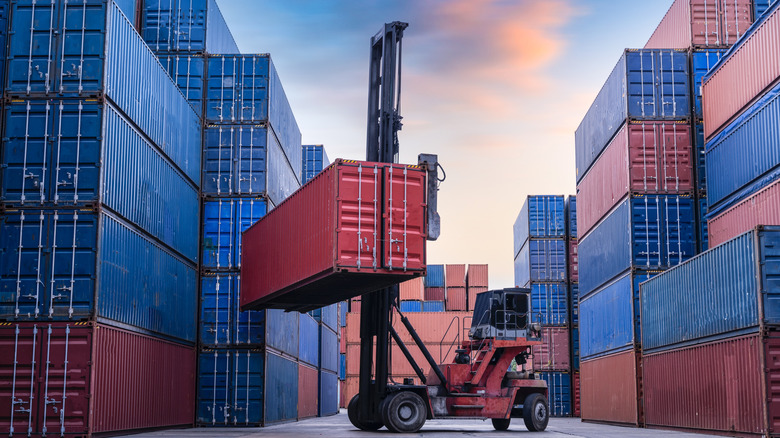 forklift stacking a cargo container