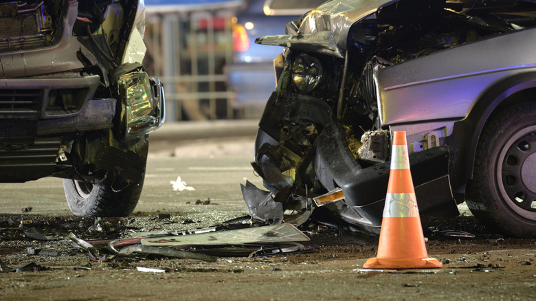 A close-up of two cars in the aftermath of an intense crash