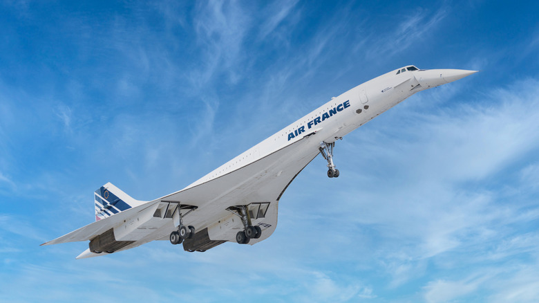 The Air France Concorde taking off, front 3/4 view, blue sky