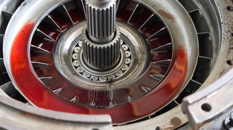 Interior view of torque converter with red automatic transmission fluid present