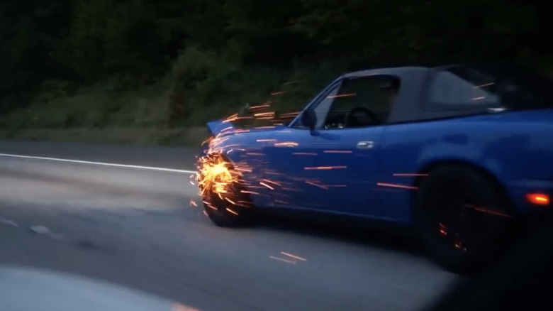 Brake pads with sparks flying off them