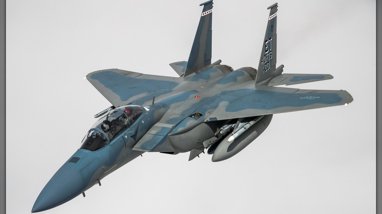 An F-15EX Eagle II flying through grey skies