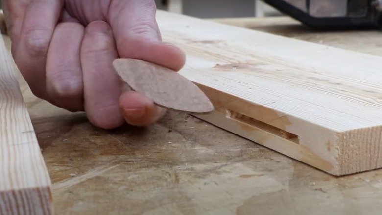 Image showing a biscuit and the slot cut for it by a biscuit joiner.