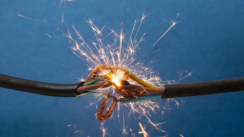 Close up of sparks produced by damaged wiring.
