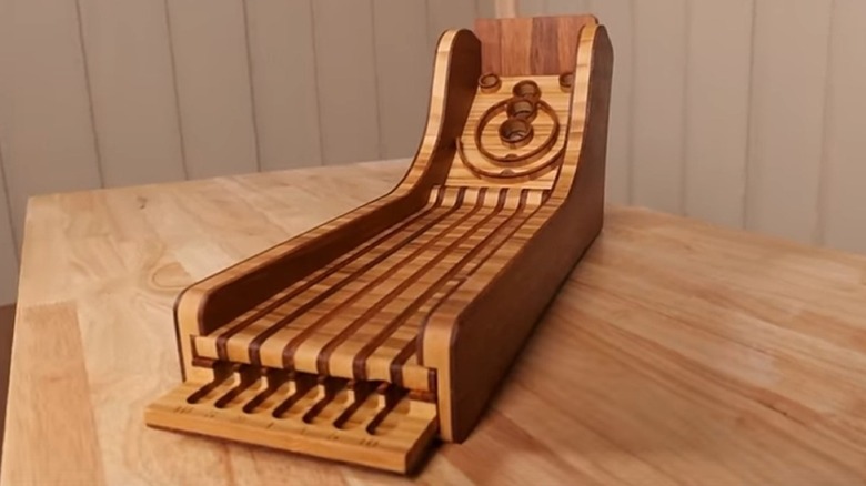 A tabletop Ski Ball woodworking project cut on a CNC router.