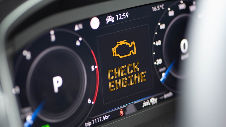 modern car interior with check engine light on
