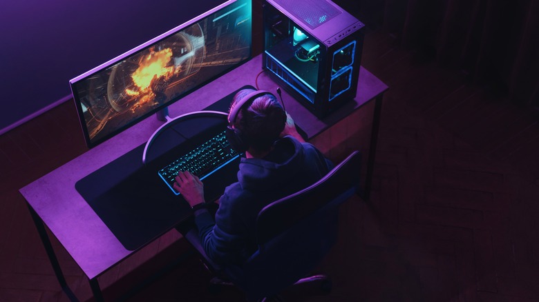 person playing game at pc