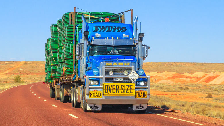 Mack Titan prime mover hauling a load on a desert road