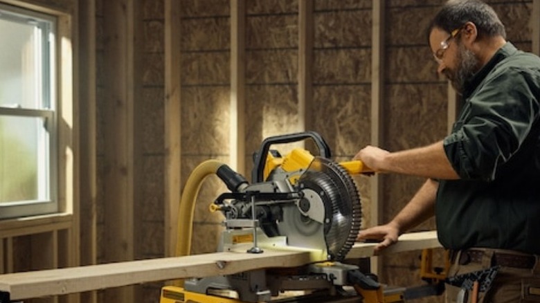 Man using DeWalt miter saw