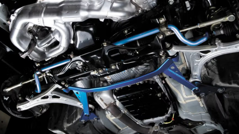 Underside of a vehicle with a Cusco sway bar.