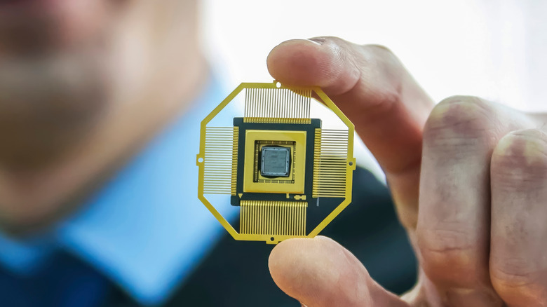 A man holds a new microchip design with a special case in hand.