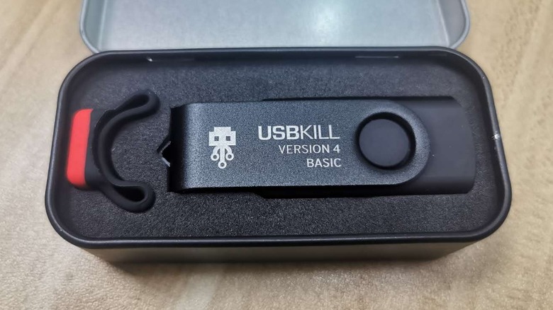 USB Kill Stick in a box on a wooden surface