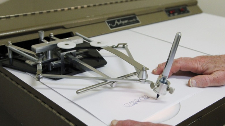 A person using an autopen.