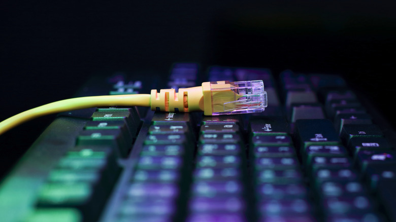 A CAT-5 cable on a computer keyboard