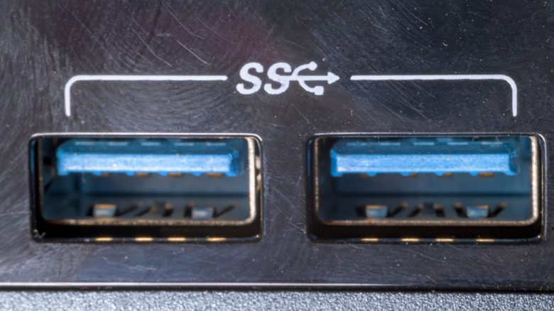 A pair of blue USB prorts with SuperSpeed USB branding