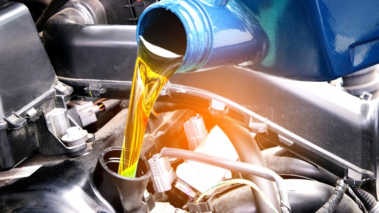 Fresh oil pouring into engine