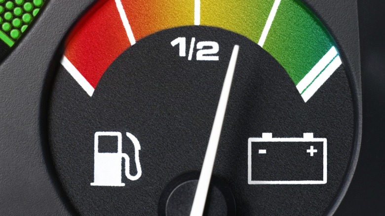 car fuel gauge showing almost three-quarters full.