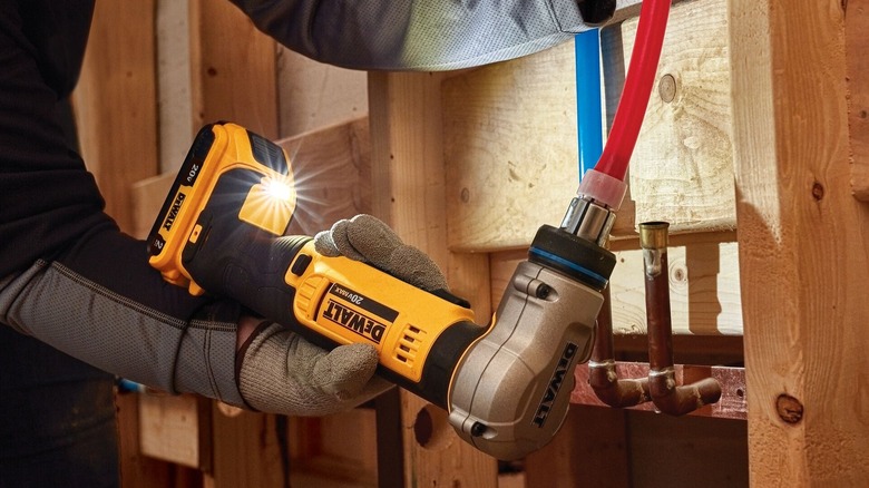 A DeWalt PEX Expander Tool Increasing the End Circumference Of A PEX A Pipe