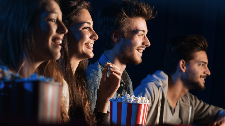 People enjoying movie theater