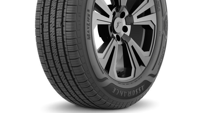 A Goodyear Assurance MaxLife 2 tire mounted on Goodyear-branded wheel on a white background
