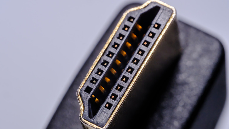 A closeup of a black HDMI cable's connector