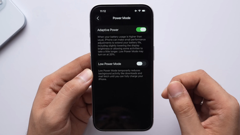 iPhone with black background showing the Adaptive Power option
