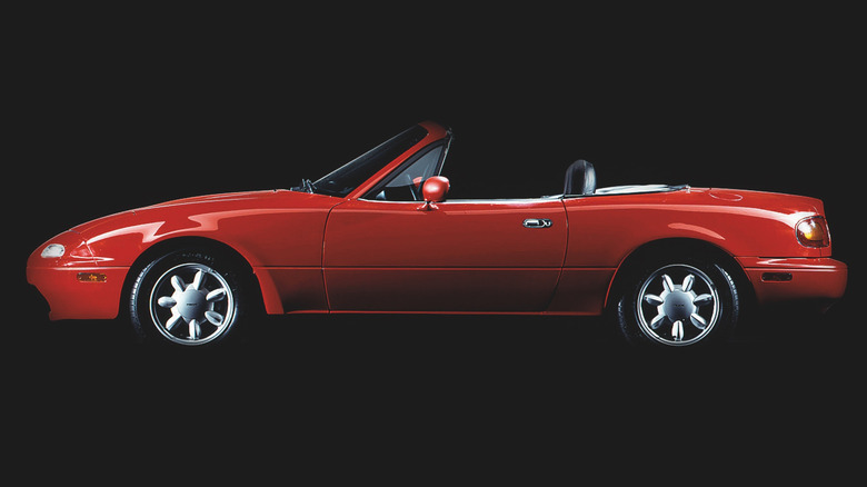 Side view of red 1990 Mazda Miata