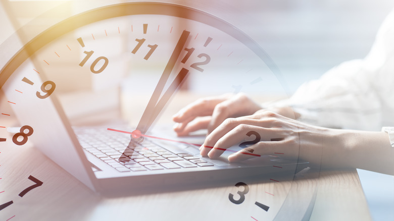 laptop with clock overlay