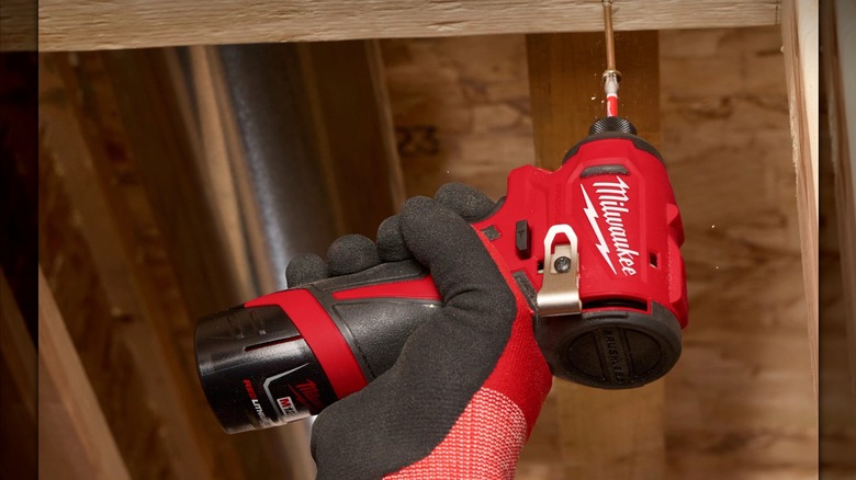 M12 Subcompact Brushless ¼-inch Hex Impact Driver being used overhead