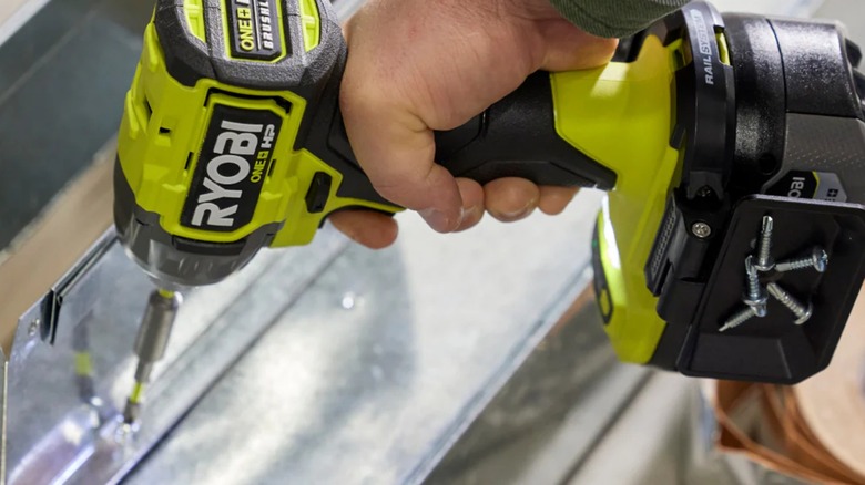 A worker using the Ryobi ONE+ HP Impact Driver.