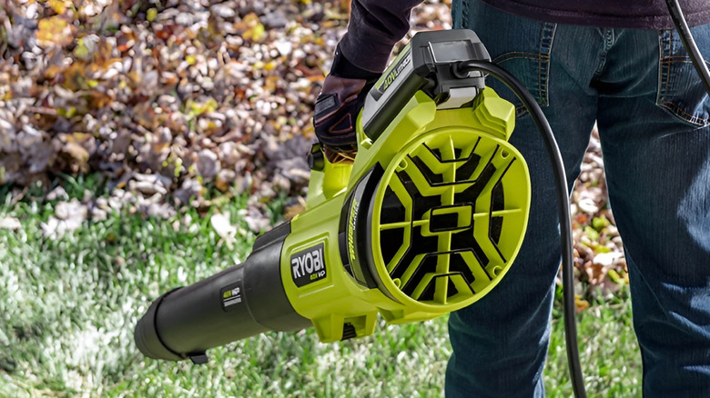 Person blowing leaves with Ryobi 40V HP blower