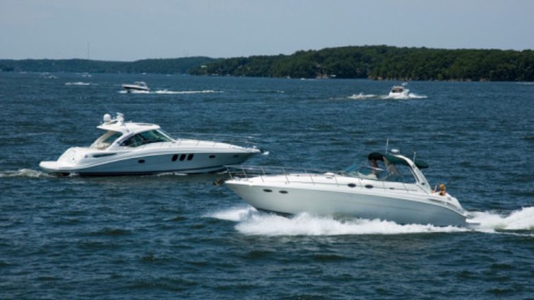 Several boats out sailing on the water