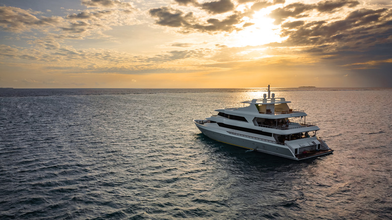 Luxury yacht at sea at sunset