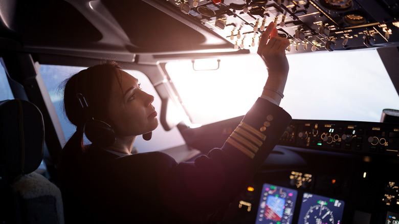 Female pilot controlling a plane