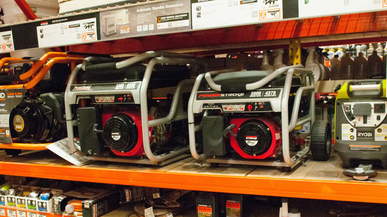 Portable gasoline generators on a shelf at Home Depot