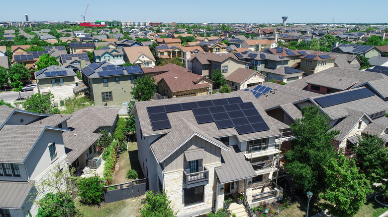 Solar panels on roofs of suburban homes