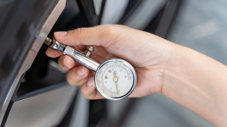Tire PSI checker on tire