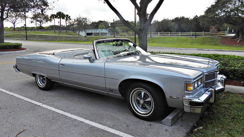 Front 3/4 view of 1975 Pontiac convertible with heavy chrome bumpers