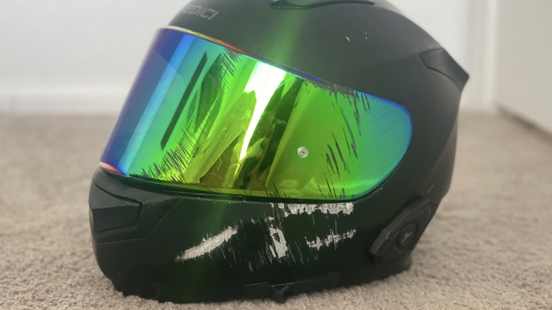 A scruffed up helmet due to a crash