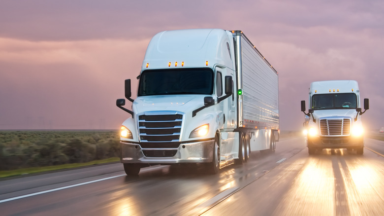 two trucks on the road.
