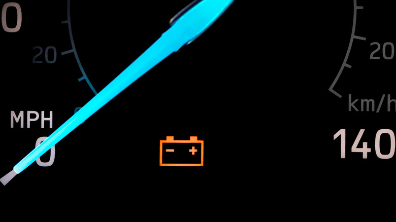 Close up of a battery warning light in a car's dashboard