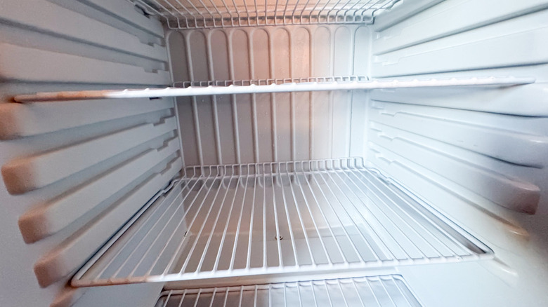 Wire shelves inside a mini fridge.