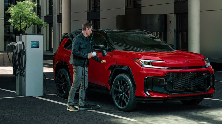 Man charging 2026 RAV4 PHEV